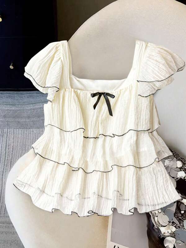 Regalyn Blusa elegante y casual de unicolor en tono albaricoque y blanco, con cuello cuadrado, doble capa de volantes en las mangas cortas, y ribete en bloques de color, para mujeres de talla grande, ideal para primavera/verano