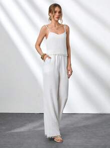 CLARA VERO Conjunto de 2 piezas de mujer con Top sin mangas de tela de bambú tejida de unicolor con detalles de pompones y pantalones rectos de pierna ancha con bolsillos laterales y pliegues delanteros. Outfit de primavera y verano para vacaciones y salidas