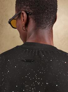 SUMWON Camiseta oversize con estampado de galaxia, diseño cósmico con chispas, apta para usarse en festivales, conciertos y eventos, con patrón celestial, uso unisex - Negro - Ver 6