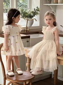 Vestido elegante de bebé niña con estampado floral de organza color albaricoque y dobladillo con volantes