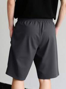 Manfinity Hypemode Shorts de verano sueltos y casuales con bolsillos laterales y cintura con cordón de un solo color