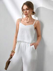 CLARA VERO Conjunto de 2 piezas de mujer con Top sin mangas de tela de bambú tejida de unicolor con detalles de pompones y pantalones rectos de pierna ancha con bolsillos laterales y pliegues delanteros. Outfit de primavera y verano para vacaciones y salidas