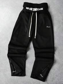 Manfinity Streetrush Pantalones deportivos de estilo callejero joven para hombres, con diseño bicolor a juego con la de la calle. Con diseño de cintura y cremalleras en los tobillos. Estos pantalones holgados presentan el eslogan "Los sueños se hacen realidad", que encarna la estética del rock callejero. Son perfectos para festivales de música y atuendos cotidianos, lo que los convierte en un excelente regalo para novios o maridos. Este estilo refleja el streetwear Y2K. Pantalones de moda de calle de 2 en 1 con dobladillo con cremallera para hombres, pantalones joggers negros para hombres, pantalones de streetwear para hombres, pantalones de streetwear para hombres, pantalones de streetwear para hombres.