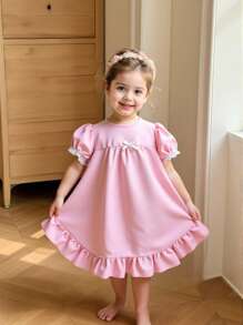 Áo ngủ dài tay ngắn màu trắng cho bé gái, có bèo nhún ở gấu và nơ xinh xắn. - Hồng - Xem 1