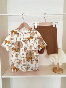 SHEIN Leap Crew 2 件套可爱水豚蝴蝶结和花卉印花休闲宽松短袖 T 恤和紧身裤套装，适合青少年和夏季