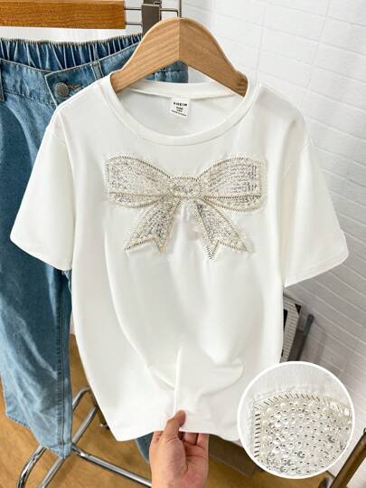 SHEIN Girls Tee, Spring/Summer Round Neck T-Shirt, Comfortable Casual Round Neck Tee, White, Cute & Sweet Style, Cute Bow Decor, Suitable For Everyday Casual Wear Bow Shirts For Girls Summer Holiday