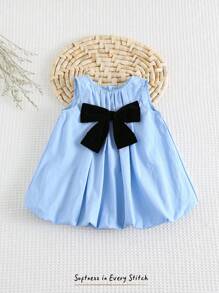Cozy Pixies Robe décontractée et polyvalente pour bébé fille nouveau-né avec col rond et sans manches, décorée d'un nœud