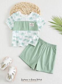 Cozy Pixies طقم (2 قطعة) من ملابس علوية ذو رقبة دائرية وأكمام قصيرة مع طباعة زهور وأشكال نباتية، وشورت خصر مطاطي للأطفال الصغار