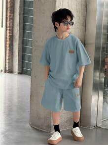 SHEIN 2pcs Tween Boys' Casual Korean White Solid Loose Knit Textured Soft Fabric College Style Round Neck Short Sleeve T-Shirt And Shorts Set, Suitable For Spring/Summer, College, Home, Daily Wear, Sports, Birthday Party, Outings, Basic & Minimalist Boy Casual Sets