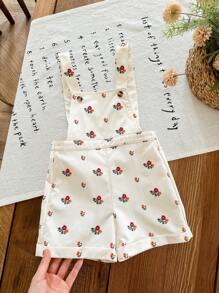 Mono de flores pequeñas en caqui lindo y versátil para bebé niña
