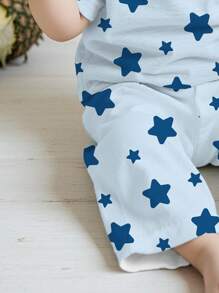 SHEIN Bộ đồ ngủ tay ngắn in hình ngôi sao năm cánh cho bé trai, dáng rộng, phù hợp cho mùa hè - Nhiều màu - Xem 4