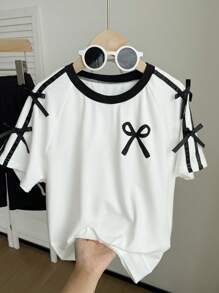 SHEIN 2 件套青少年女孩休闲百搭美式学院风，蝴蝶结装饰节日主题，黑白拼接宽松短袖蝴蝶结印花 T 恤和黑色紧身短裤，适合上学、郊游、度假、春夏季年轻女孩套装夏季