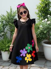 Abito da ragazza con balze, scollo rotondo e motivo tropicale floreale, adatto per vacanze al mare e outfit coordinati mamma-figlia