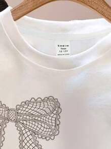 SHEIN Leap Crew 少女休闲简约纹理蝴蝶结图案超大 T 恤，适合夏季上衣，少女图案 T 恤，轻松舒适，家庭出游季节，家庭出游，休闲装，家庭出游，家居清新，优雅，酷炫服装系列，轻松舒适，轻松运动 - 白色 - 查看 6