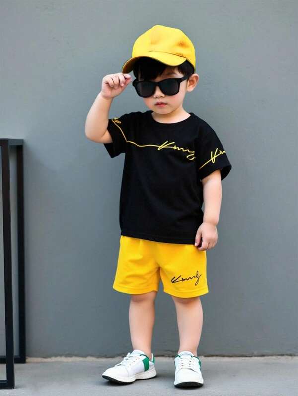 SHEIN 2pcs/Set Baby Boys' King Line Print Round Neck Short Sleeve Black T-Shirt And Yellow Shorts Casual Outfit