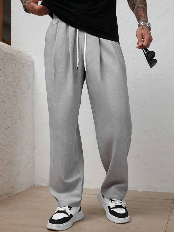 Manfinity Homme بنطلون رجالي كاجوال بخصر مطاطي مربوط بحبل سحب، موحد اللون