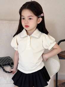 Zomers modieus en elegant geplooide kraag pofmouw T-shirt top, jong meisje