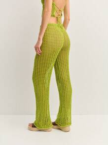 Nöista Los pantalones de ganchillo se caracterizan por un diseño de tejido abierto, cintura con cordón y piernas acampanadas para un aspecto relajado y bohemio. Perfectos como cubrecosturas para la playa o para combinarlos con estilo en festivales y escapadas soleadas con un Charm sin esfuerzo. - Verde - Ver 2