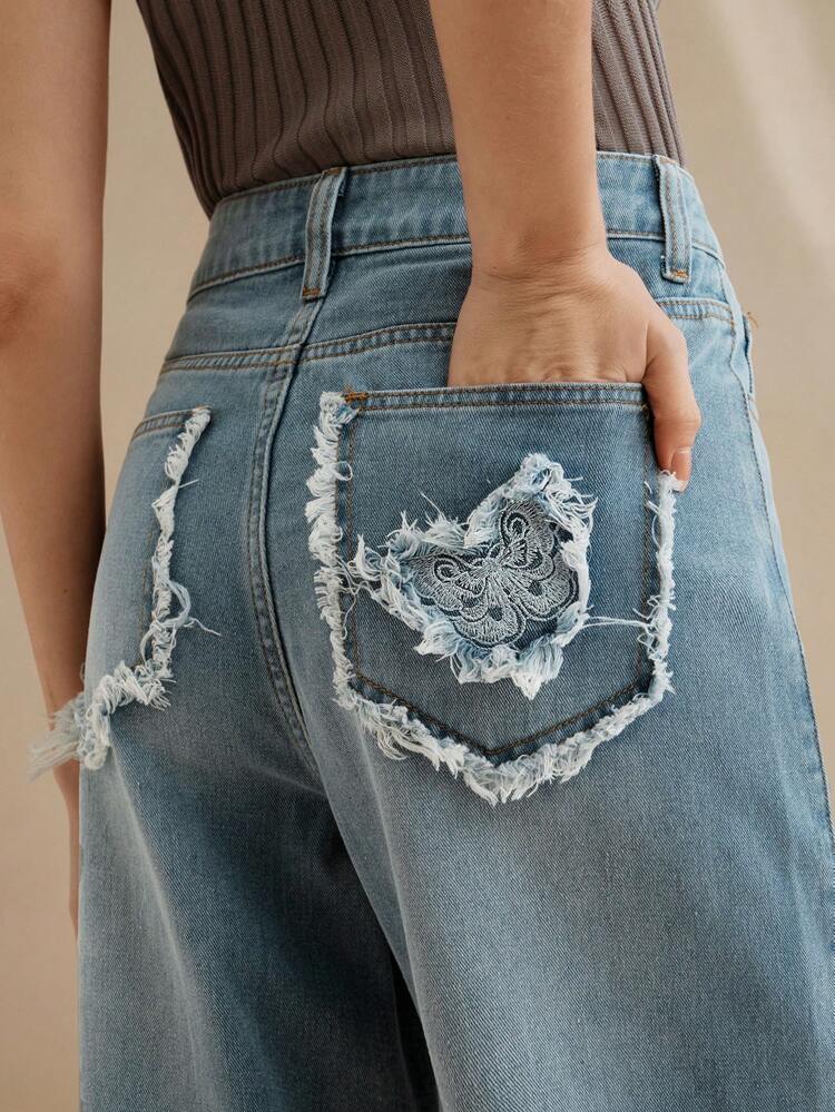 Women's Casual Long Denim Jeans With Unique Butterfly Embroidery And Frayed Hem Detail