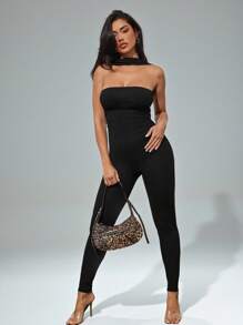 Denimoi Mono escotado y sin espalda con cuello de halter