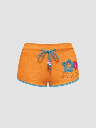 ROMWE Avant شورت رياضي للنساء مطبوع عليه زهرة الخبيزة وأشكال الدلافين من مجموعة جيرو هاواي بيتش ريزورت