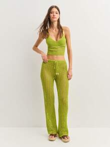 Nöista Los pantalones de ganchillo se caracterizan por un diseño de tejido abierto, cintura con cordón y piernas acampanadas para un aspecto relajado y bohemio. Perfectos como cubrecosturas para la playa o para combinarlos con estilo en festivales y escapadas soleadas con un Charm sin esfuerzo. - Verde - Ver 3
