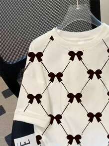 INAWLY Koszulka damska z okrągłym dekoltem i nadrukiem w kokardę w dużym rozmiarze