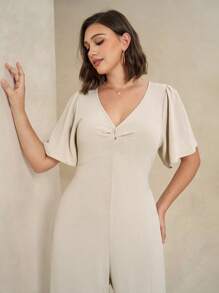 Chikora جمبسوت غير رسمية فاخرة ذات ياقة على شكل V مع تويست على الخصر للنساء مقاسات كبيرة