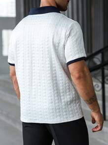 Manfinity Homme Große Größen Polo-Shirt mit Farbblockdesign und strukturierter Kurzarm Optik für Herren