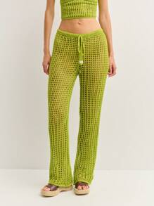 Nöista Los pantalones de ganchillo se caracterizan por un diseño de tejido abierto, cintura con cordón y piernas acampanadas para un aspecto relajado y bohemio. Perfectos como cubrecosturas para la playa o para combinarlos con estilo en festivales y escapadas soleadas con un Charm sin esfuerzo. - Verde - Ver 1