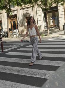 Nöista Pantalones acampanados a rayas con cintura elástica cómoda. Perfecto para atuendos de verano, vibraciones del festival de São João o looks relajados para vacaciones en EE. UU. Mezcla suave de lino.