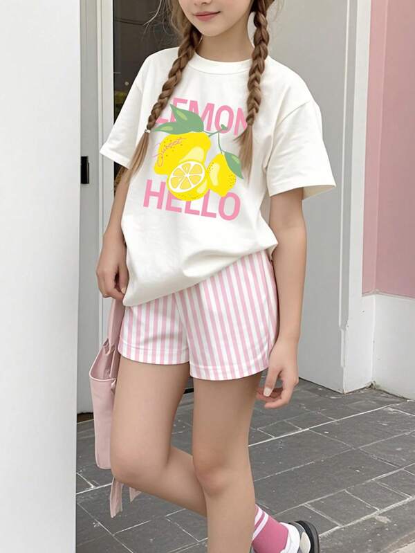 SHEIN Conjunto informal de 2 piezas para niñas preadolescentes con camiseta de gráfico con estampado de limón y lema, y pantalones cortos