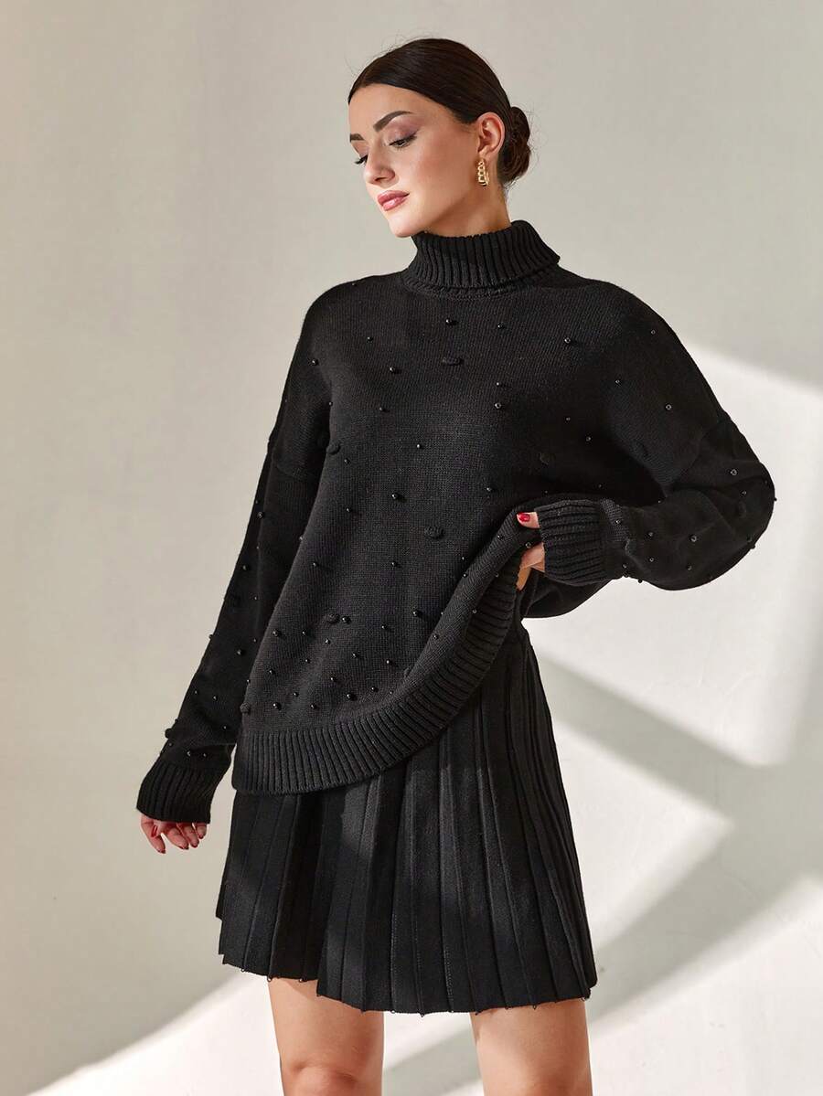 EURMUSE Ensemble deux pièces femme composé d'un pull détaillé de perles et d'une jupe pull plissée