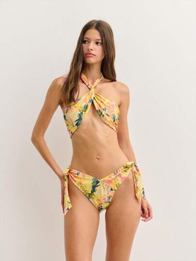 Nöista This Vibrant Floral Bikini Set Features A Twisted Halter Top With A Keyhole Cutout And High-Cut Tie-Side Bottoms. Its Colorful Tropical Print Makes It Perfect For Beach Getaways, Pool Parties, Or Sun-Soaked Vacations.