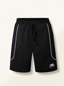 Pantaloncini corti casual sportivi neri con stampa a lettere per ragazzi pre-adolescenti, adatti per l'estate