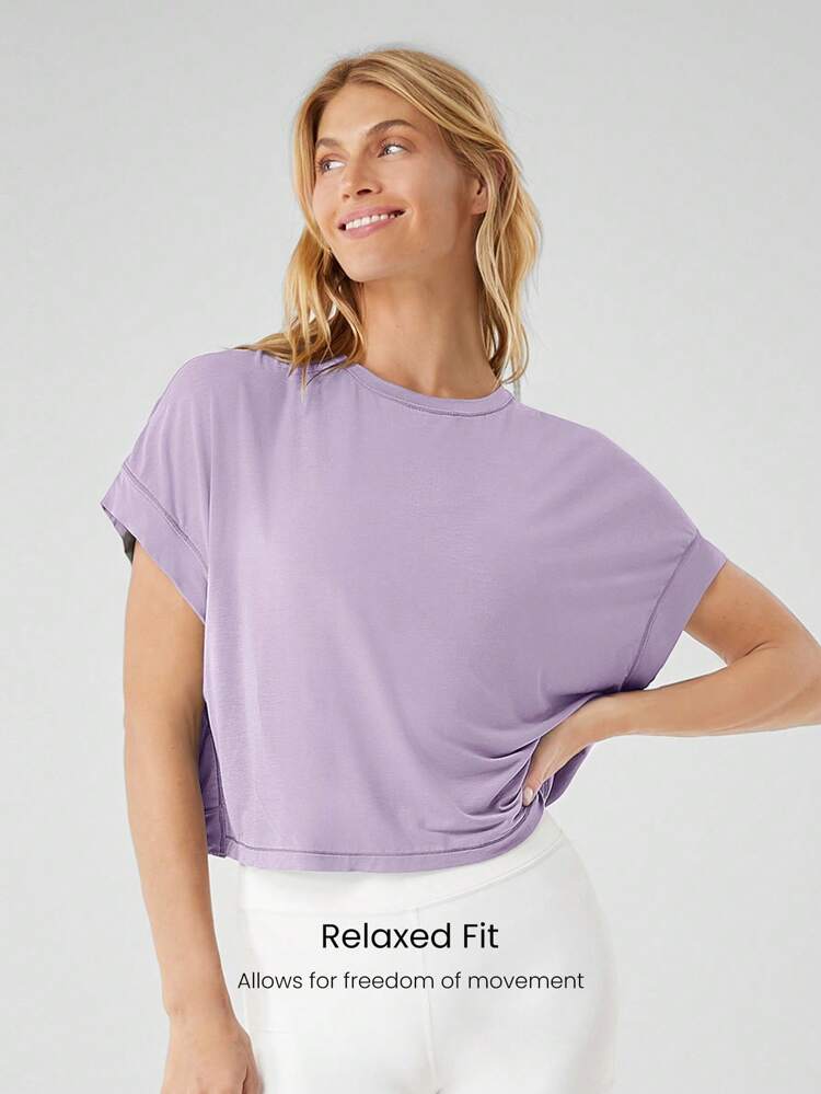 Camiseta corta de manga corta oversize de modal con escote en la espalda para yoga de bajo impacto y uso diario casual