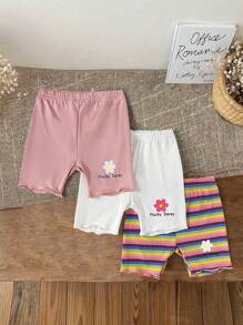 女婴三件套短裤，彩色条纹和花卉图案。春夏新品现已上市。舒适时尚、可爱休闲简约的风格，是日常穿着的必备单品。