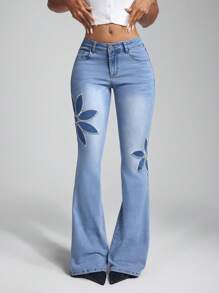 Jeanoix Jeans acampanados lavados con aplicaciones y bordados a la moda