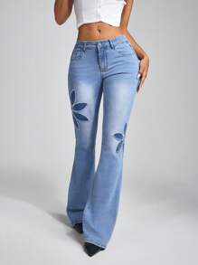 Jeanoix Jeans acampanados lavados con aplicaciones y bordados a la moda