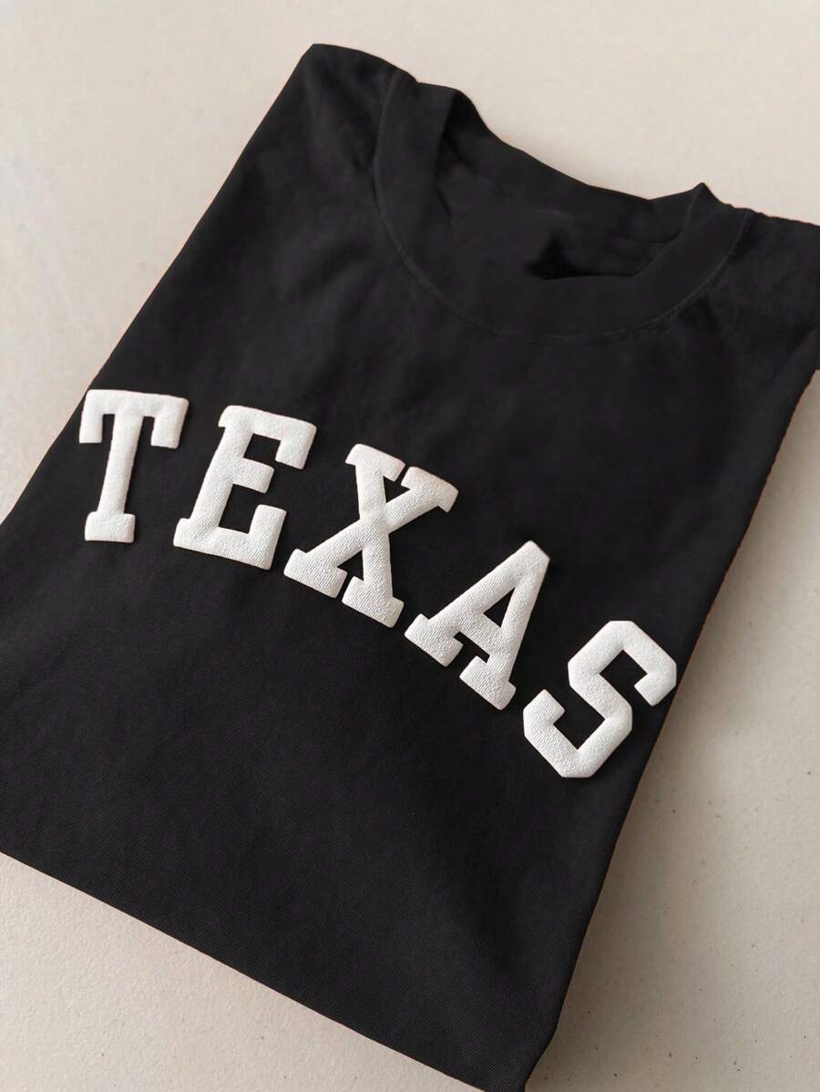 SHEIN Camiseta de manga corta y puffy de vinilo suave y colorida para hombre y mujer tipo cuello redondo, camiseta gráfica para dama de Texas - Negro - Ver 1