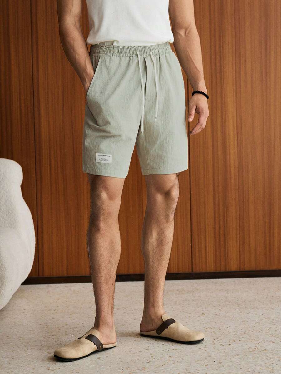 SWAVVY 男士棉质字母补丁细节抽绳腰短裤宽松膝盖尼龙酷神纯色薄荷绿度假常规短裤适合丈夫