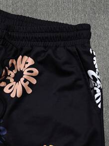 Manfinity LEGND Shorts casuales diarios sueltos con cordón y bolsillos estampados para hombre de talla grande