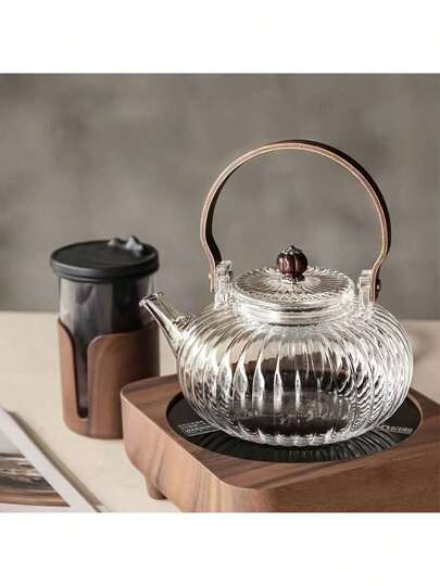 إبريق شاي من الزجاج البورويسليكات مع مقبض خشبي ، ويتميز بتصميم زهرة الأقحوان المزهرة وأوراق الشاي الفضفاضة ، مثالي لأوقات القراءة المسترخية
