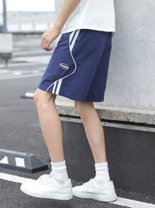 SHEIN Lässige, locker sitzende Basketball-Shorts für Tween Jungen mit seitlichen Kontrastbändern, bequem und vielseitig für Sommer, Urlaub, Outdoor - Blau - Übersicht 1
