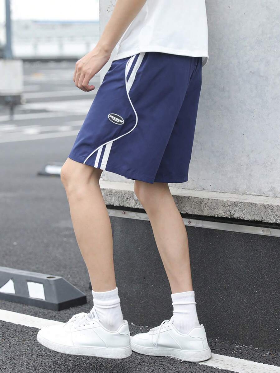 SHEIN Lässige, locker sitzende Basketball-Shorts für Tween Jungen mit seitlichen Kontrastbändern, bequem und vielseitig für Sommer, Urlaub, Outdoor - Blau - Übersicht 1