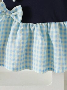 Jong meisje marineblauwe gebreide patchwork geruite jurk met schattige strikdecoratie, frisse stijl casual vakantie mode jurk voor meisjes