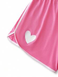 Conjunto de 2 piezas para adolescentes: Camiseta de cuello redondo de manga corta con decoración de lazo para niños y conjunto de pijama corto con estampado de corazón para niñas
