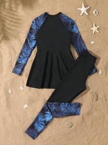 SHEIN Conjunto de 2 piezas de biquini para niñas preadolescentes: Top tipo chaleco sin mangas con estampado floral, cierre con cremallera; Bottom: Falda negra con estampado floral de retazos, traje de baño de dos piezas