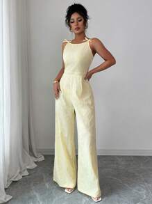 Elenzga Elegante mono de pierna ancha con decoración de lazo en los hombros y estampado floral de margaritas en tela de brocado, adecuado para el uso diario