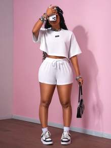 Slaydiva Bộ đồ thể thao mùa hè mới, phong cách đường phố, retro, kiểu dáng sinh viên, gồm áo thun cổ tròn tay ngắn và quần short siêu ngắn màu trắng, kiểu dáng rộng rãi, cỡ lớn, thoải mái, bộ đồ hai mảnh cho nữ. - trắng - Xem 5
